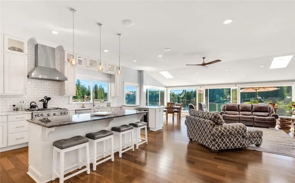 Spacious kitchen and living room with view.