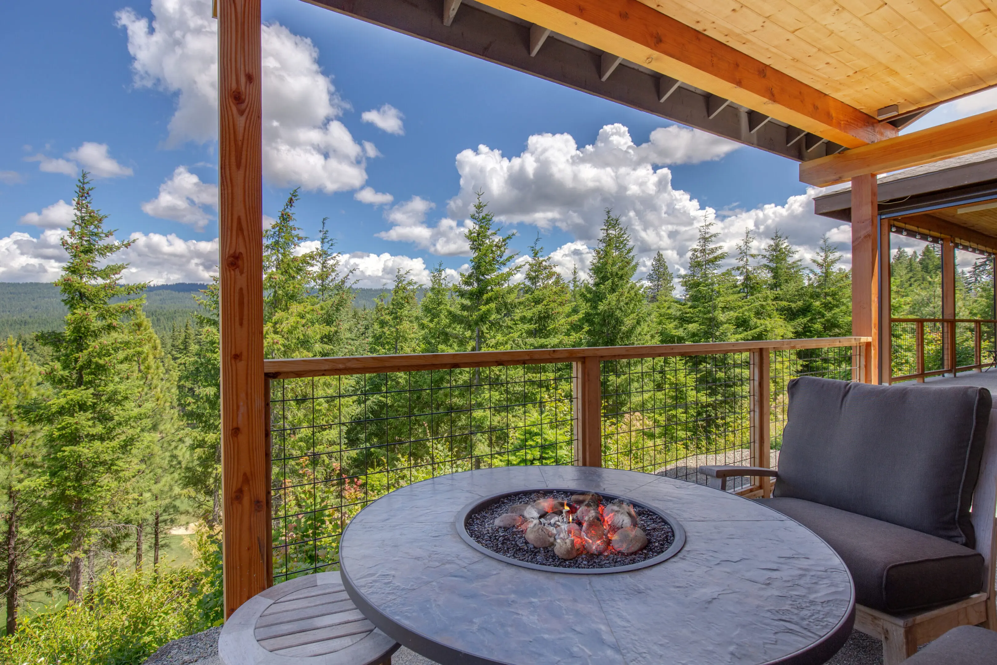 Amazing,Balcony,Patio,With,Fire,Pit,And,Forest,And,Mountains